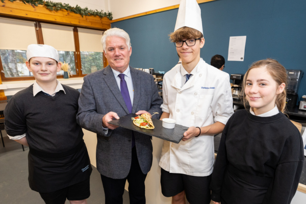 Highland Student Crowned Winner in Inverness Castle Experience Recipe Competition - In the middle, Cllr Ian Brown and competition winner Ally Franklin on each side classmates (L) Tom Richards and (R) Rowan Matthews