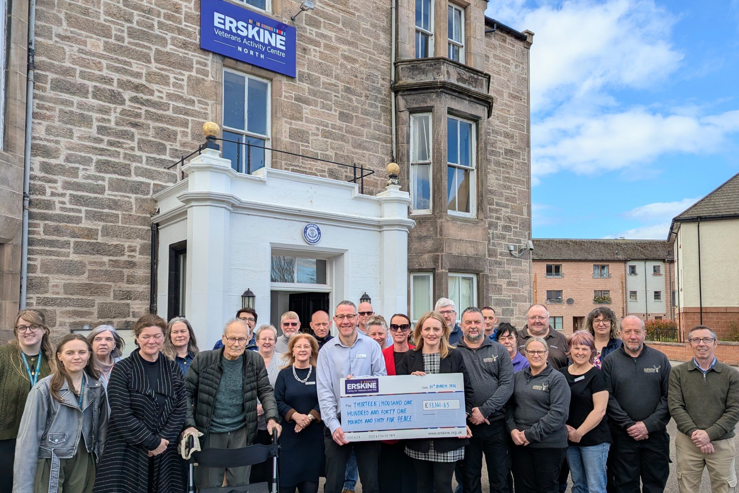 Gordon & MacPhail cheque presentation - EVAC team